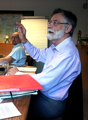 ELC President Jean Thiébaut Haessig takes part in group-discussions on "living in an ecumenical world." In the back, ELC Secretary George Samiec listens in.